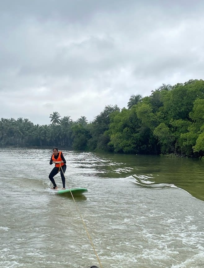 Wake surfing using motor boat