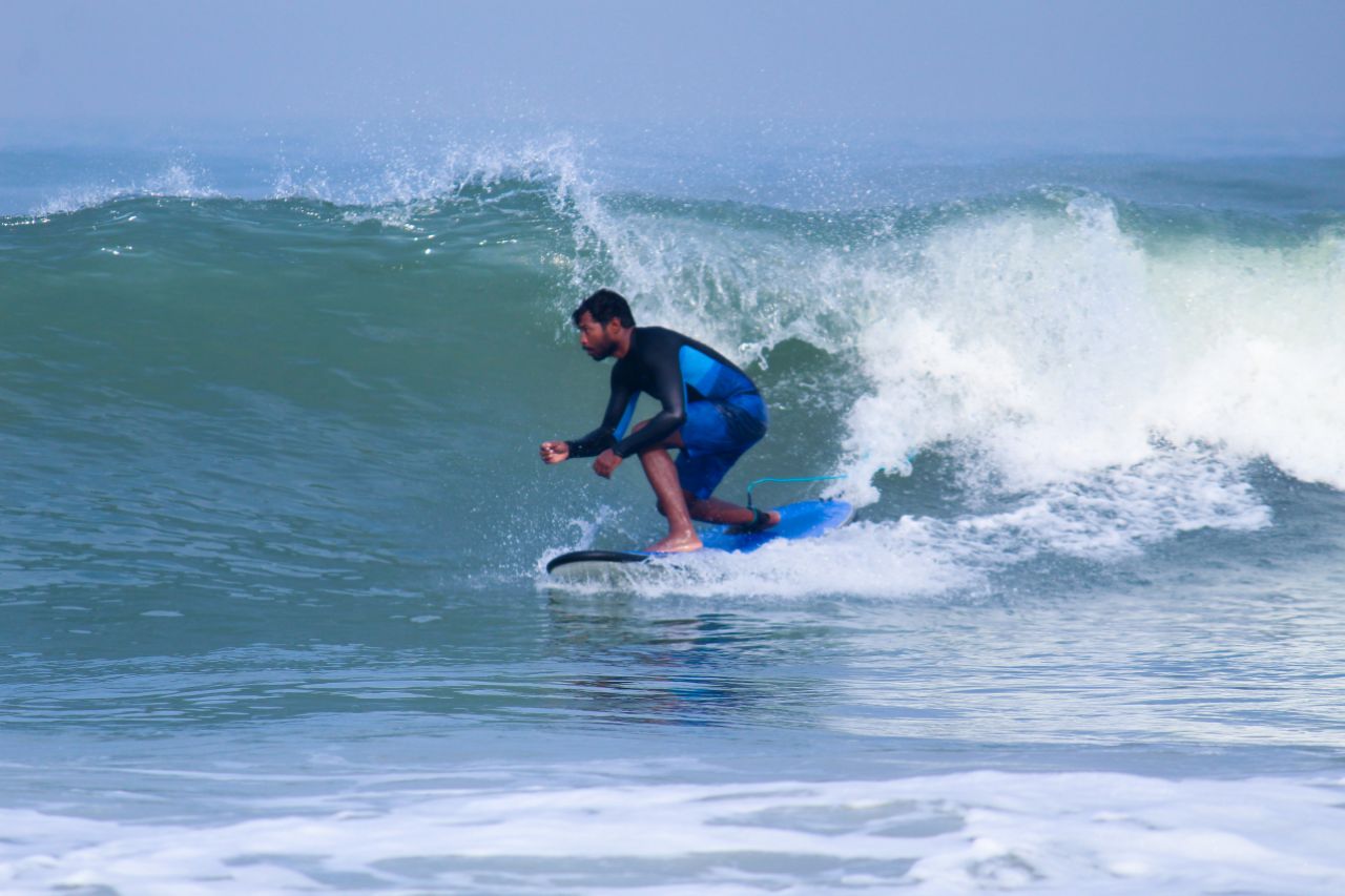 surfing at panambur beach
